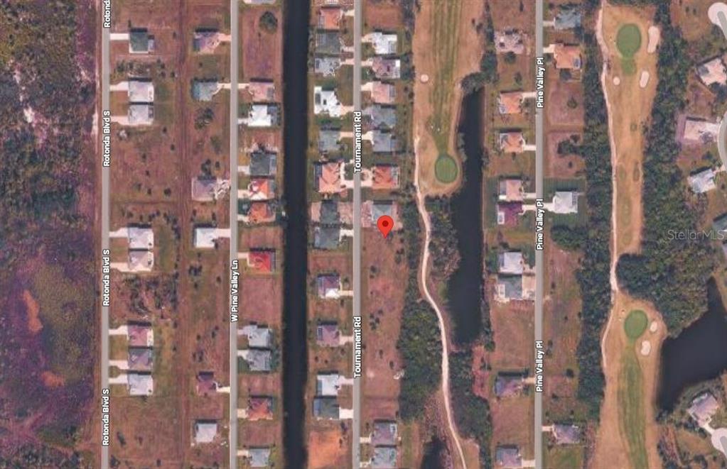 This is an aerial map view of a residential neighborhood with a marked vacant lot — 212 TOURNAMENT ROAD, ROTONDA WEST, FL