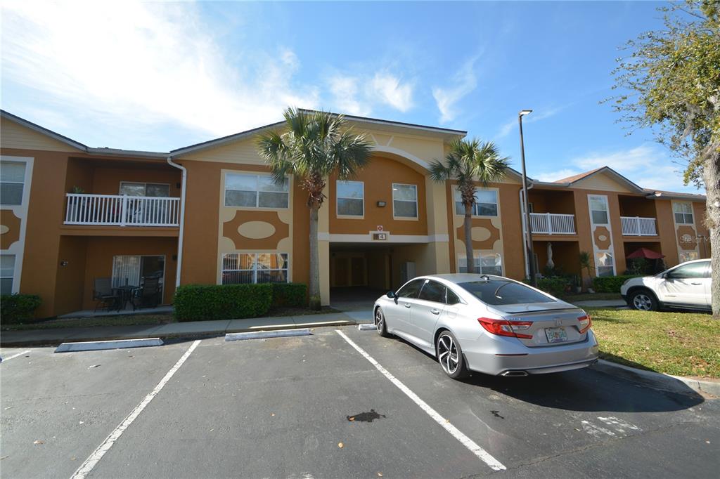A two-story apartment building with a parking lot in the foreground — 4600 E MOODY BOULEVARD UNIT 4H, BUNNELL, FL