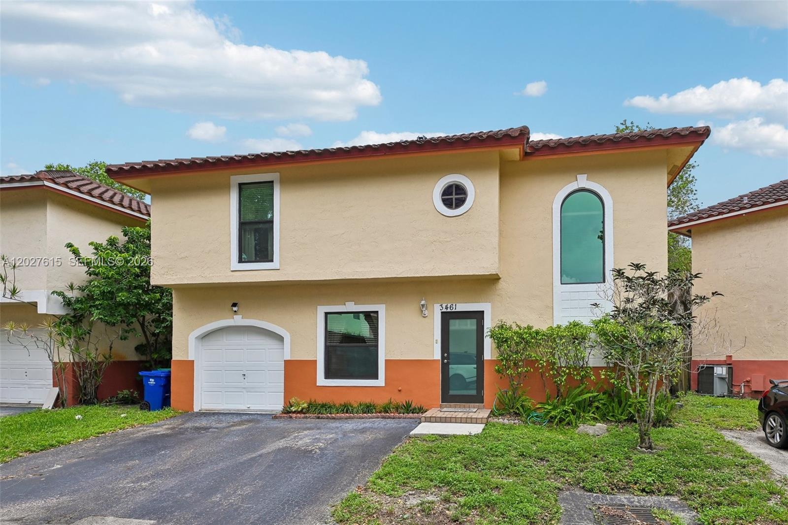 A two-story house with a garage, stucco exterior, and a tiled roof — 3461 Cluster Rd, Miramar FL 33025, MIRAMAR, FL