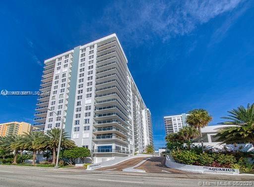 A tall white residential apartment building stands under a clear blue sky — 2751 S Ocean Dr # 701N, Hollywood FL 33019, HOLLYWOOD, FL