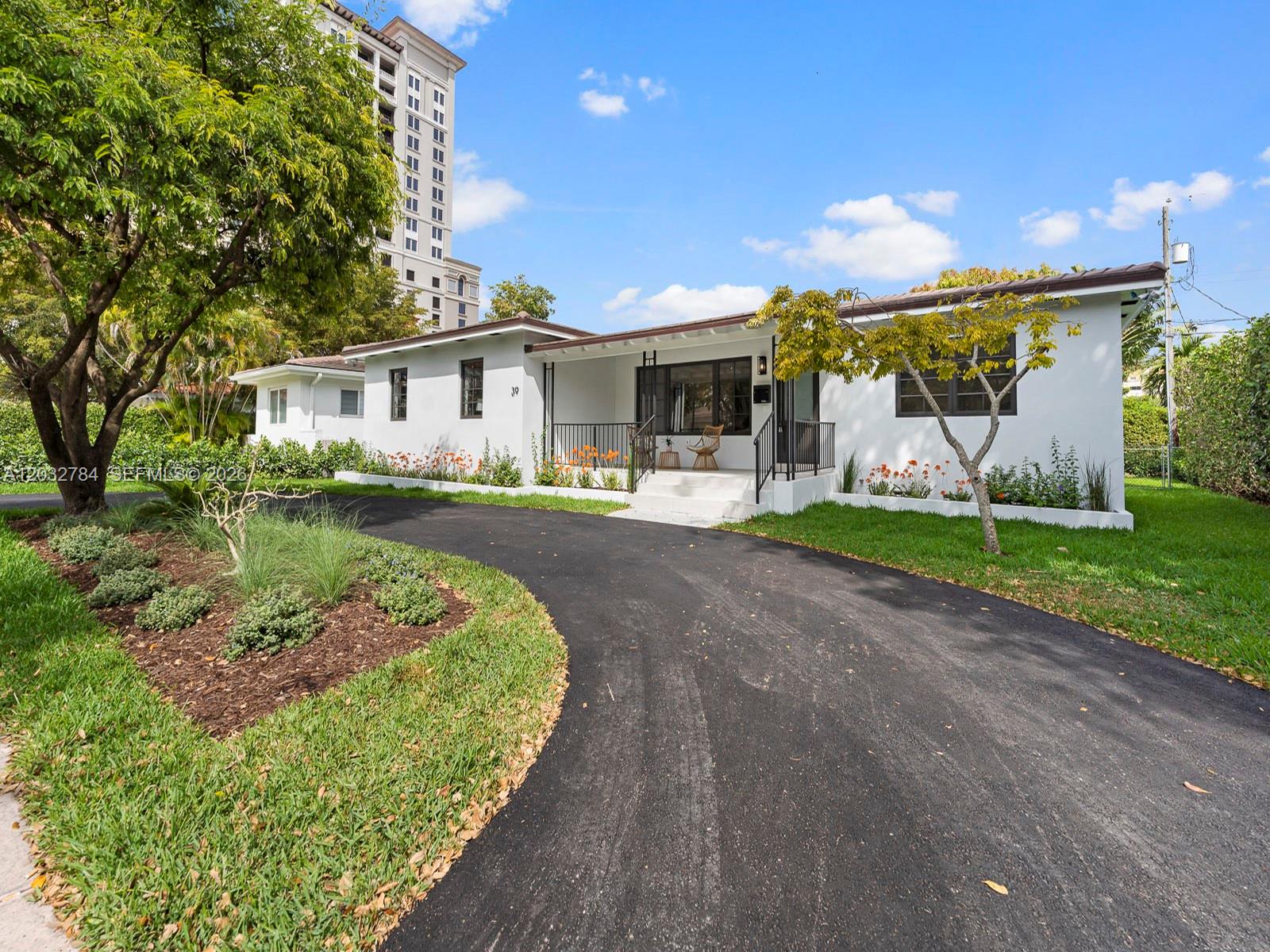 A white single-story house with a curved driveway and a small front porch — 39 Palermo Ave, Coral Gables FL 33134, CORAL GABLES, FL