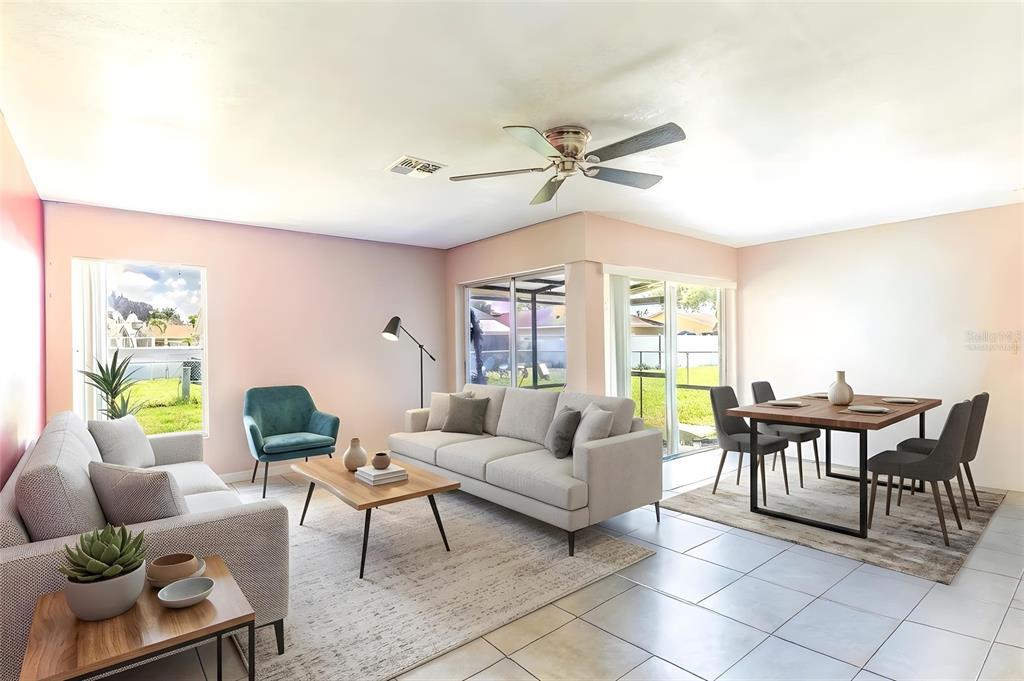 A living and dining room with light-colored tile floors, a ceiling fan, and pink walls — 443 BALL COURT, KISSIMMEE, FL
