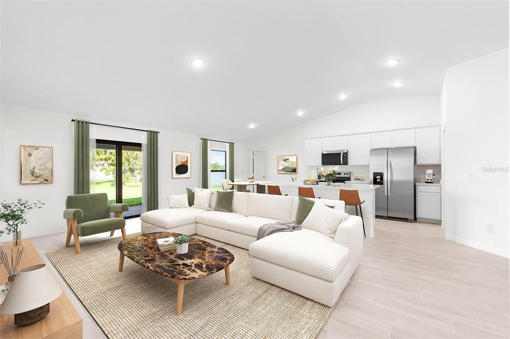 This is a digital rendering of an open-concept living room and kitchen with white cabinetry — 2172 SHILO STREET, PORT CHARLOTTE, FL