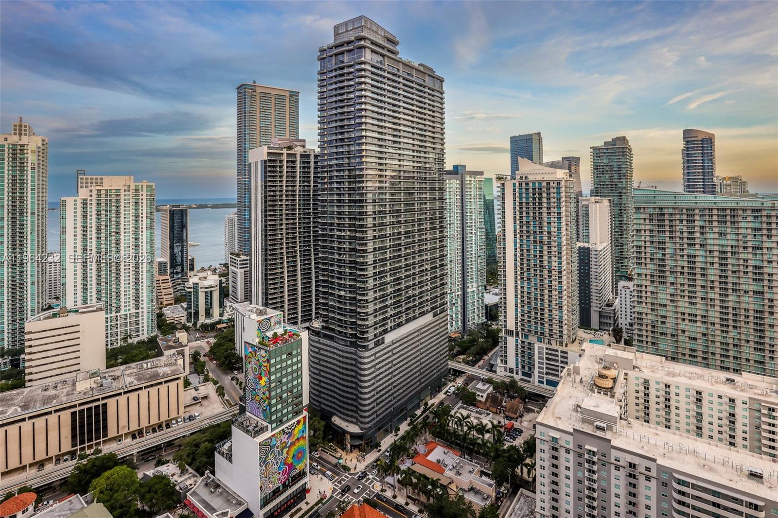 An aerial view of a dense urban skyline featuring numerous high-rise residential and commercial buildings — 55 SW 9th St # 3906, Miami FL 33130, MIAMI, FL