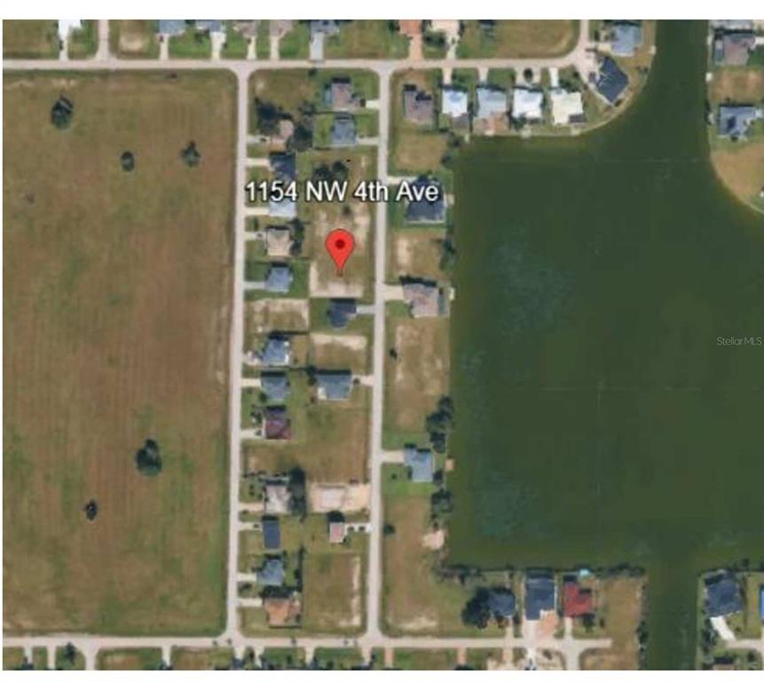 An aerial map view shows a vacant residential lot marked with a red pin — 1154 NW 4TH AVENUE, CAPE CORAL, FL