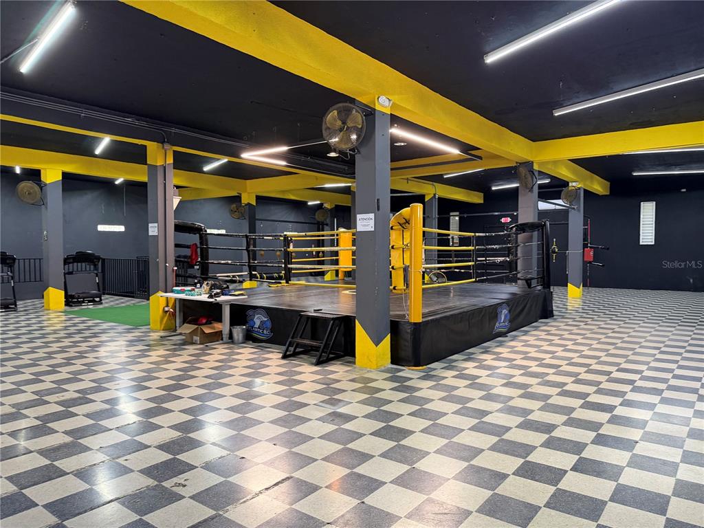 A boxing ring sits in the center of a gym with a checkered floor — 158 CALLE PROGRESO, AGUADILLA, PR