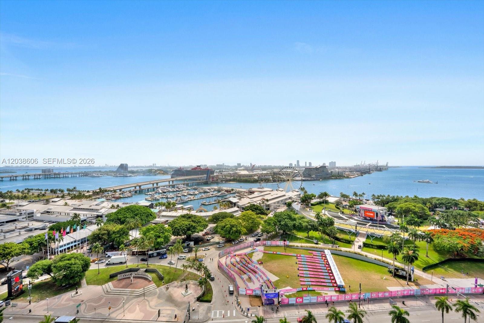 An elevated outdoor view shows a park, a marina, a Ferris wheel, and a bridge — 244 Biscayne Blvd # 1803, Miami FL 33132, MIAMI, FL