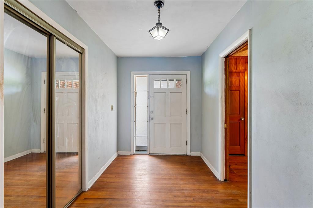 This is a floor plan of a single-story house featuring three bedrooms and a garage — 1022 S MILDRED AVENUE, BROOKSVILLE, FL