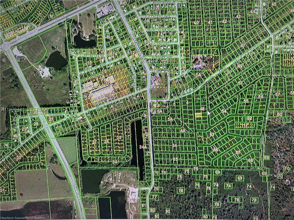 This is an aerial map showing a residential neighborhood with numbered property lots — 910 ORANGE BROOK Lane, Punta Gorda FL 33982, PUNTA GORDA, FL