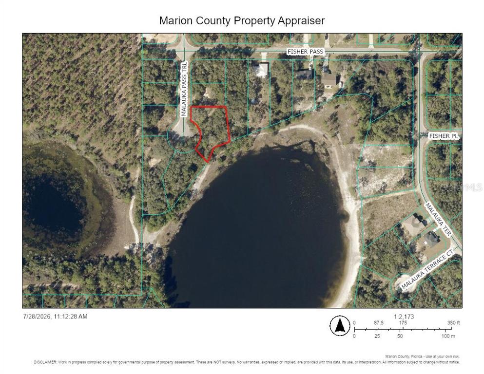 This is a property map showing a vacant lot outlined in red near a lake — TBD MALAUKA PASS TRAIL, OCKLAWAHA, FL