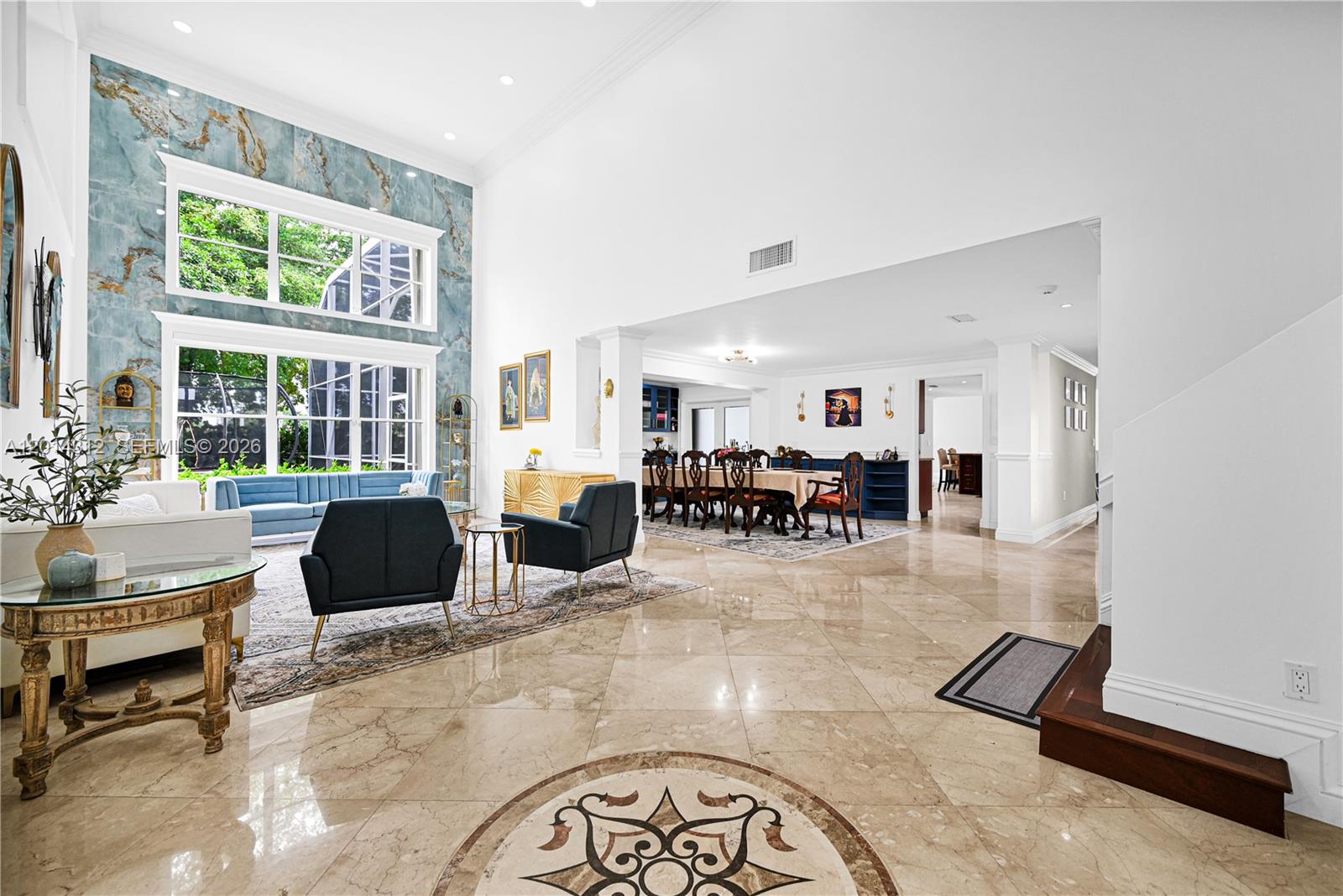 A spacious living and dining area features high ceilings, marble floors, and large windows — 9866 SW 111th Ter # 9866, Miami FL 33176, MIAMI, FL