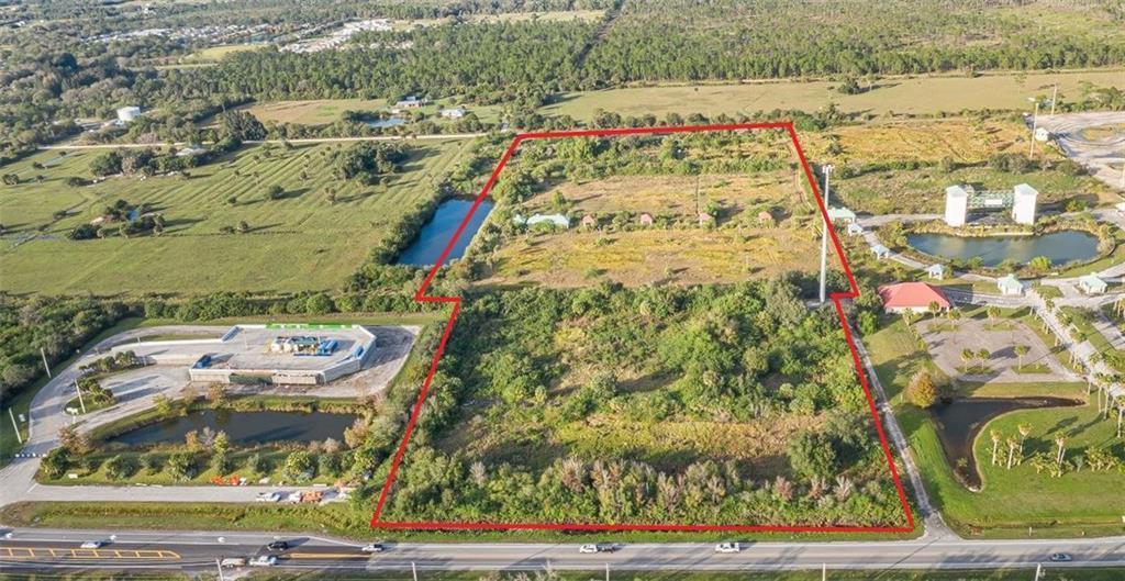 An aerial view shows a large, rectangular, undeveloped plot of land outlined in red — 9555 Mesa Park Boulevard, Fellsmere FL 32948, FELLSMERE, FL