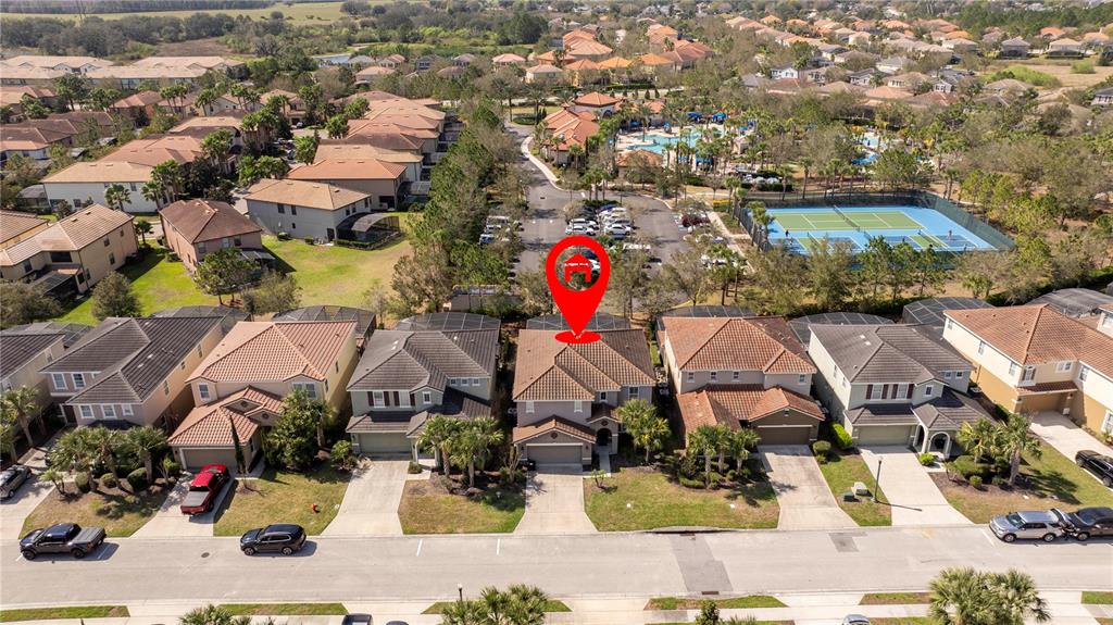An aerial view shows a suburban neighborhood with a red location pin over a house — 5251 WILDWOOD WAY, DAVENPORT, FL
