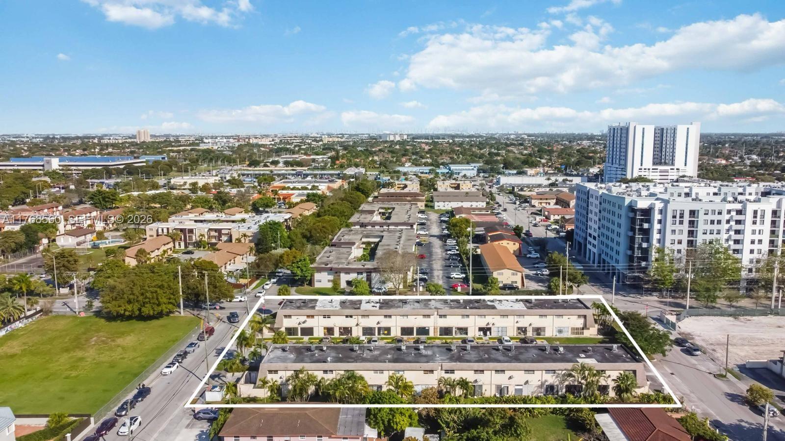 An aerial view shows two long, multi-unit residential buildings enclosed within a white rectangular outline — 10904 SW 2nd, Sweetwater FL 33174, SWEETWATER, FL