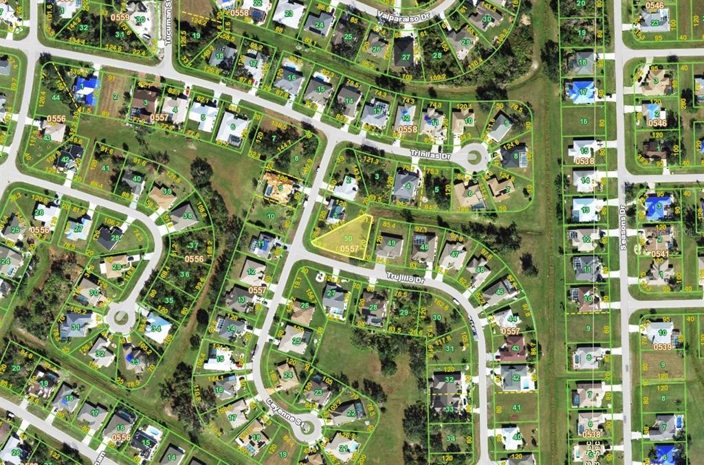 This is an aerial map showing a residential neighborhood with houses, streets, and lot lines — 26476 TRUJILLO DRIVE, PUNTA GORDA, FL