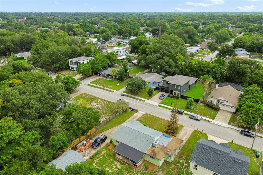 An aerial view shows a residential neighborhood with houses, driveways, and surrounding trees — 3742 MARTIN STREET, ORLANDO, FL