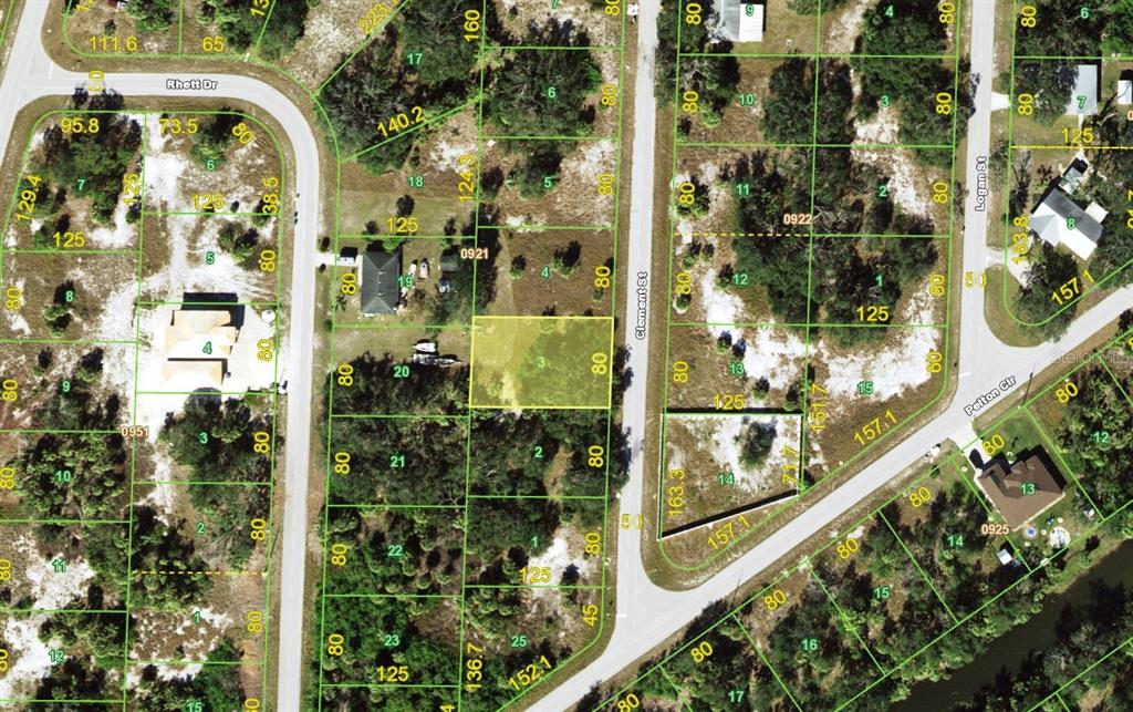 This is a satellite map showing a vacant lot highlighted in yellow within a residential neighborhood — 57 CLEMENT STREET, PORT CHARLOTTE, FL