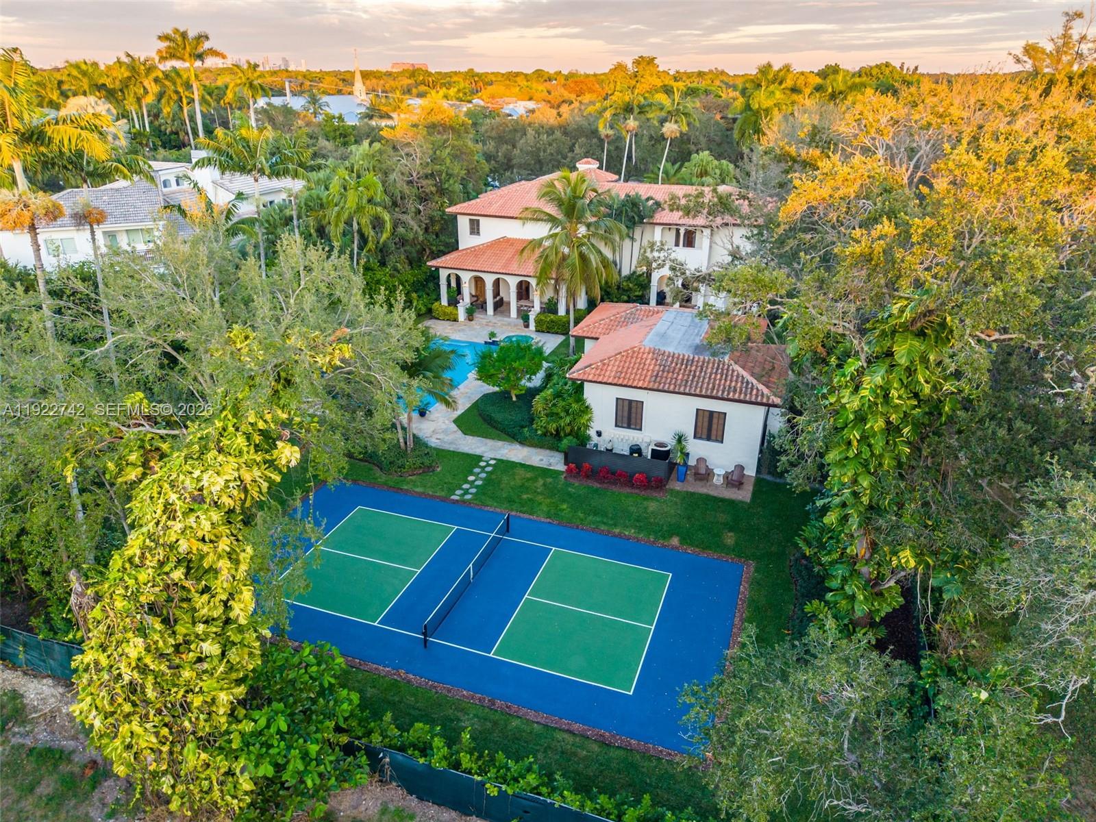 An aerial view shows a house with a pool and a pickleball court — 8800 SW 57 Ave, Pinecrest FL 33156, PINECREST, FL