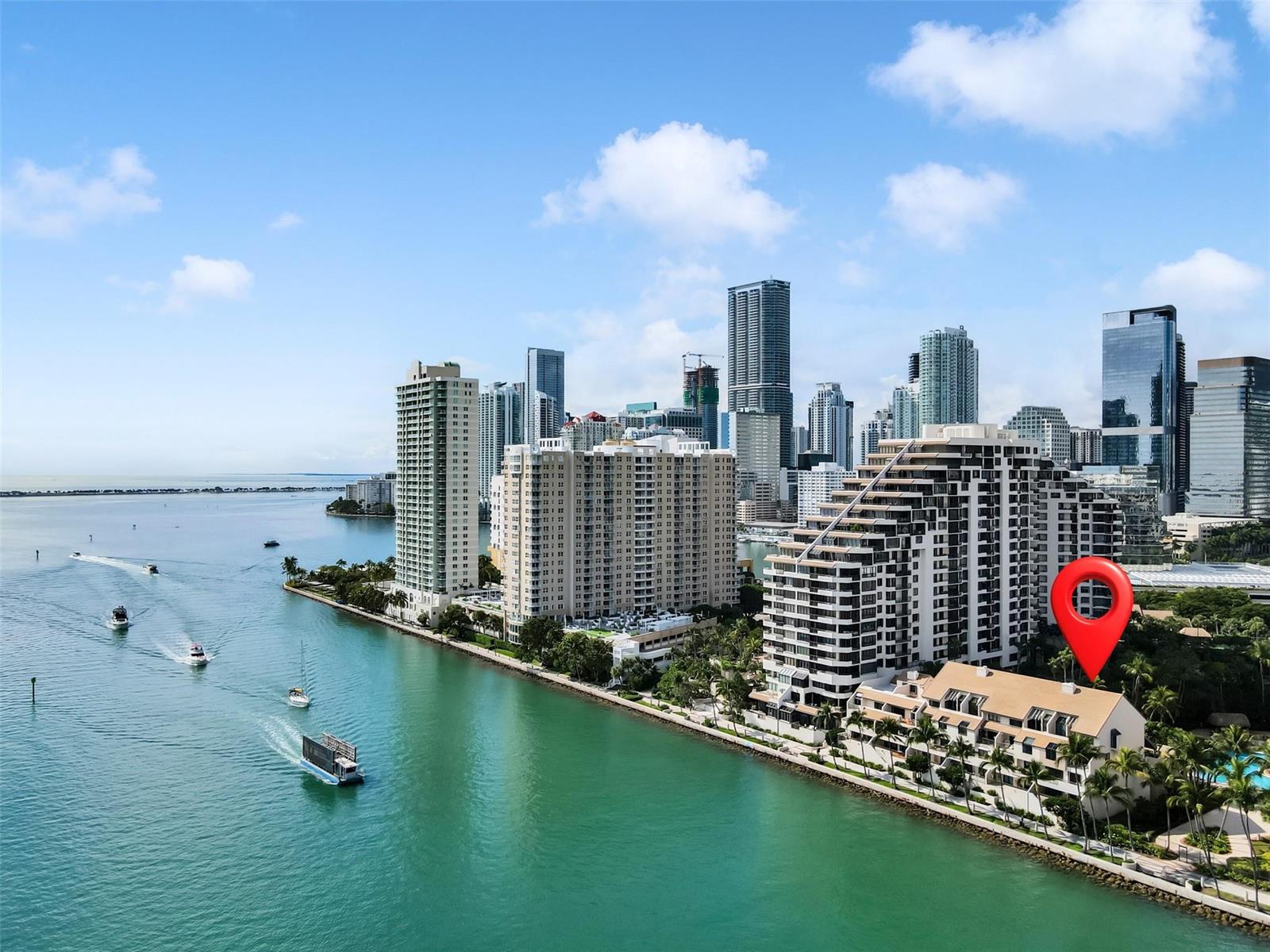 An aerial view of a waterfront condominium complex in Miami with a red location pin — 520 E Brickell Key Drive, Miami FL 33131, MIAMI, FL