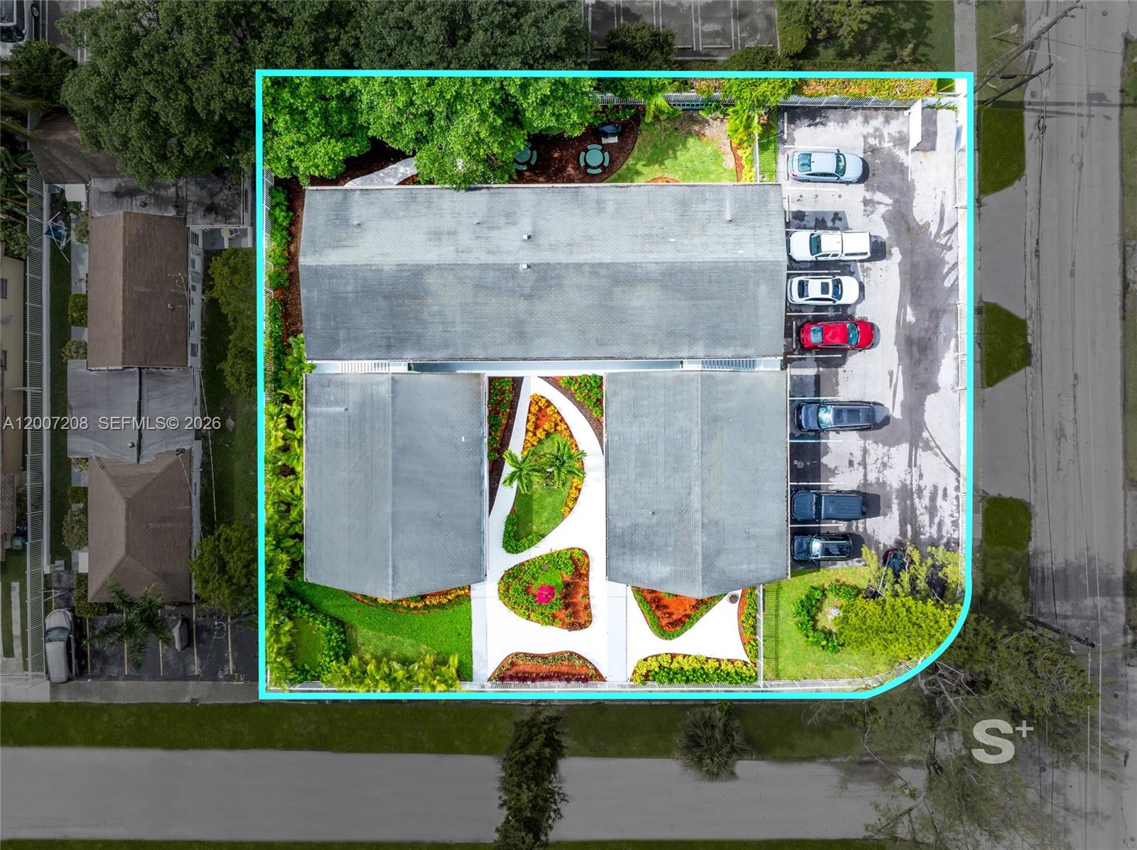 An aerial view shows a building with a central courtyard, landscaping, and a parking lot — 1300 NE 110th St, Miami FL 33161, MIAMI, FL