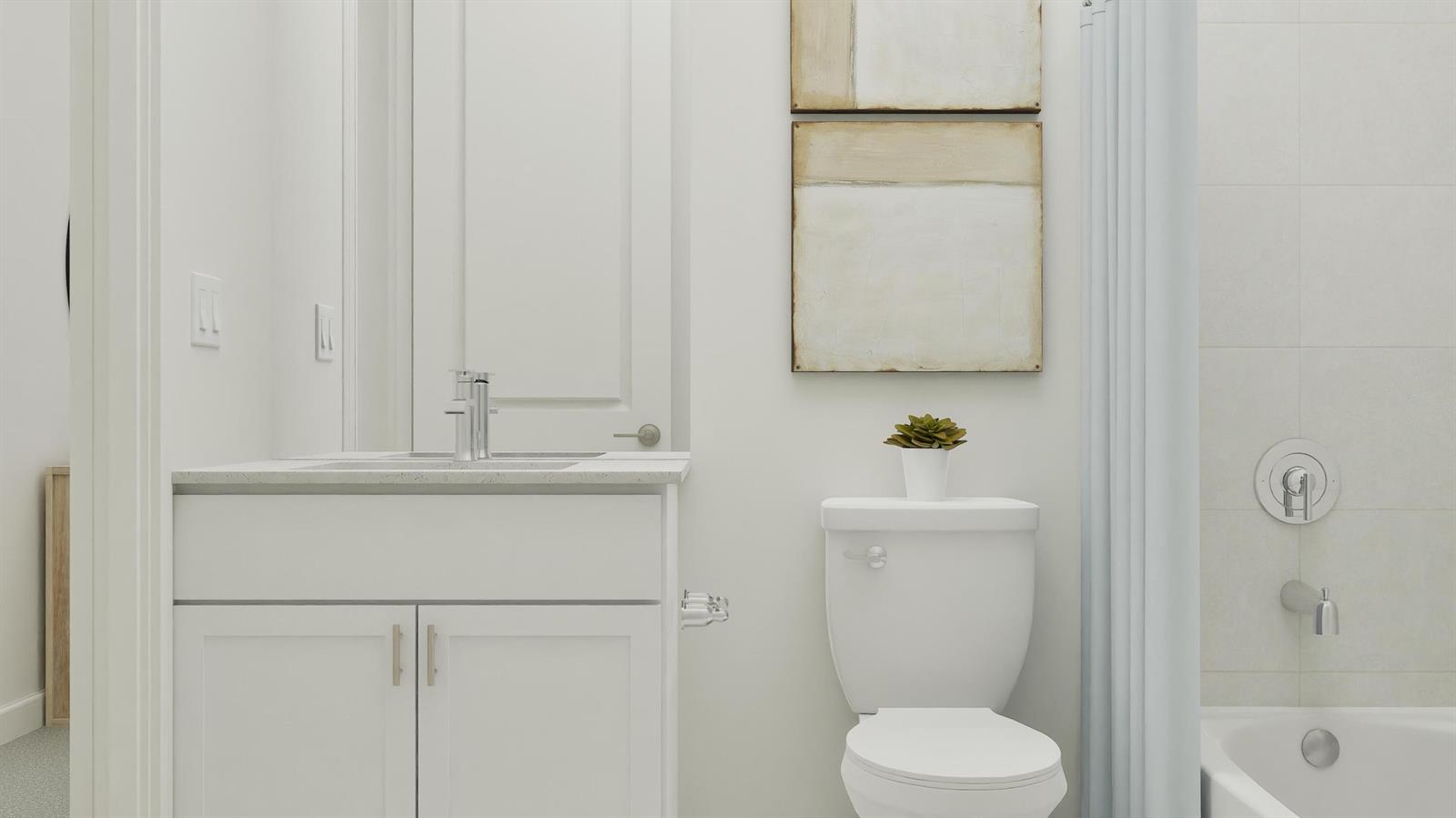 A bathroom features a white vanity, a toilet, and a bathtub with a shower curtain — 1018 Raleigh Way, Wellington FL 33414, WELLINGTON, FL