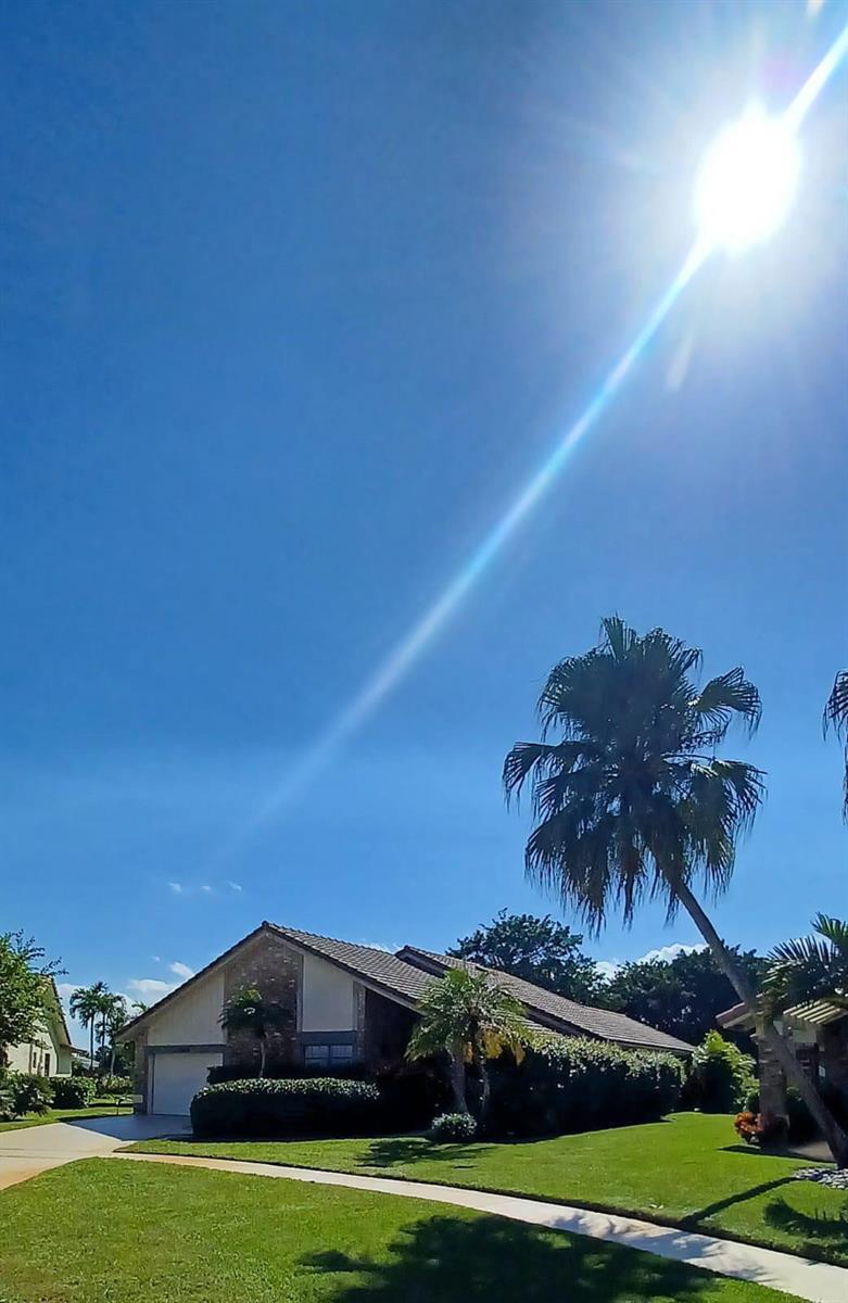 A suburban house with a palm tree in the front yard under a bright sun — 10544 Fenway Place, Boca Raton FL 33498, BOCA RATON, FL