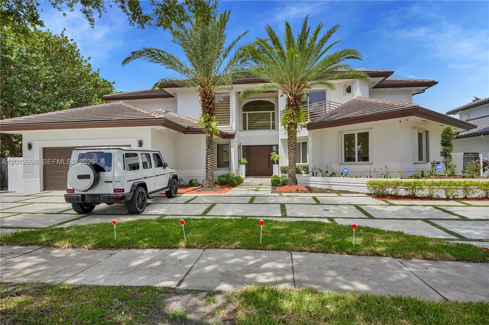 A white two-story house with a paved driveway and a parked SUV in front — 14332 Ardoch Pl, Miami Lakes FL 33016, MIAMI LAKES, FL