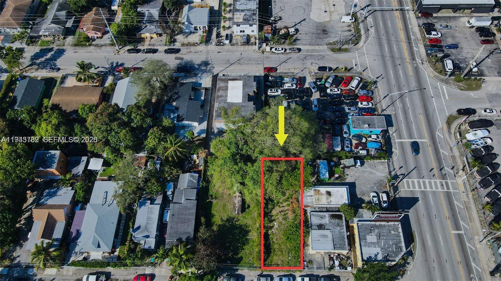 An aerial view shows a rectangular vacant lot outlined in red amidst urban surroundings — 7828 NW 5th Ave, Miami FL 33150, MIAMI, FL
