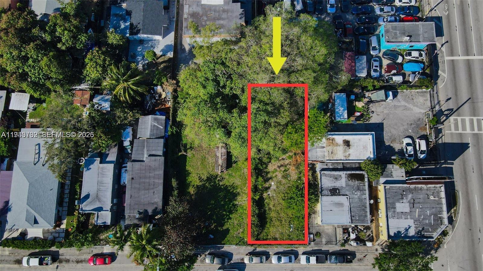 An aerial view shows a rectangular, tree-covered vacant lot outlined in red between two buildings — 7828 NW 5th Ave, Miami FL 33150, MIAMI, FL