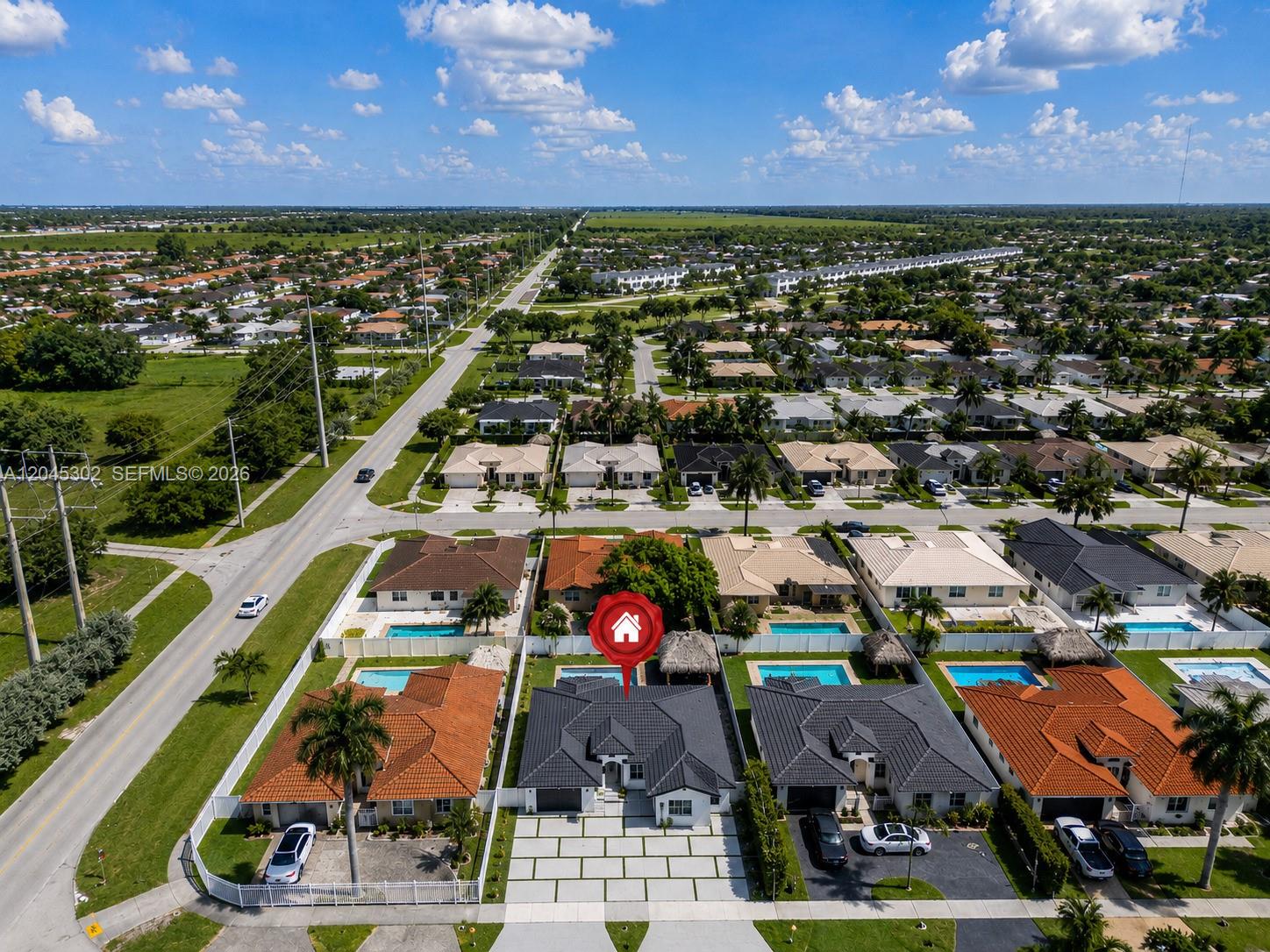 An aerial view shows a residential neighborhood with a highlighted single-family home featuring a pool — 14712 SW 176th Ter, Miami FL 33187, MIAMI, FL