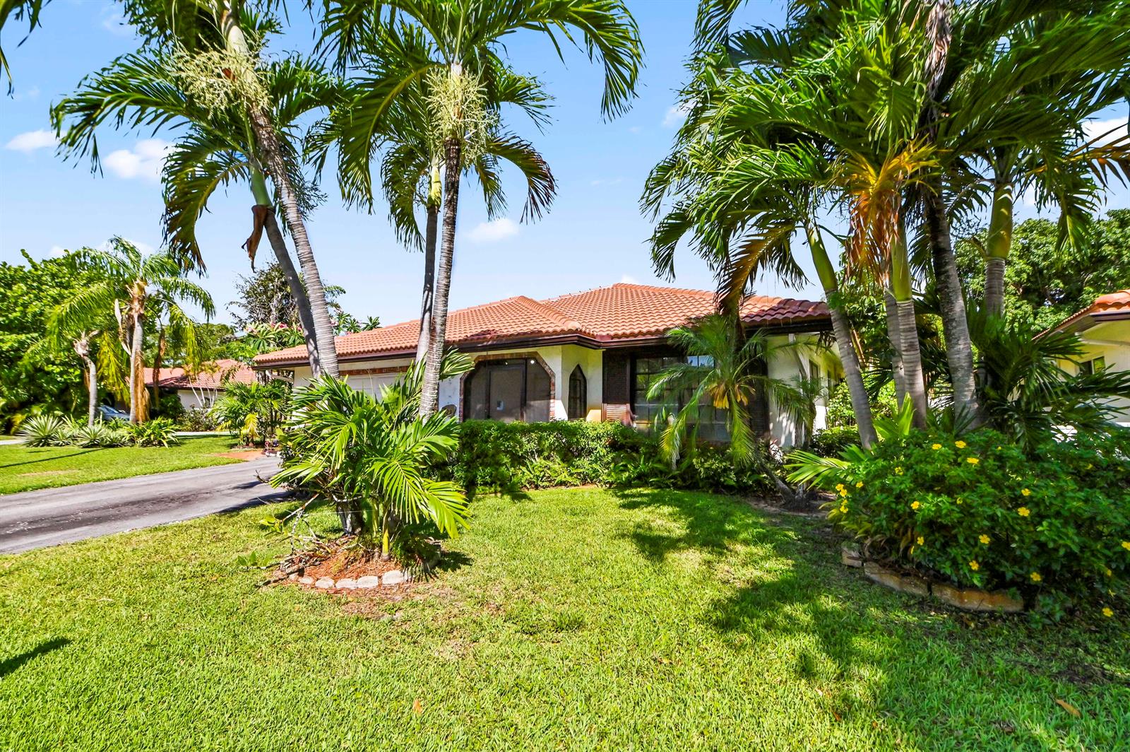 A single-story house with a tiled roof and palm trees in the front yard — 329 Knob Hill Boulevard, Boca Raton FL 33431, BOCA RATON, FL