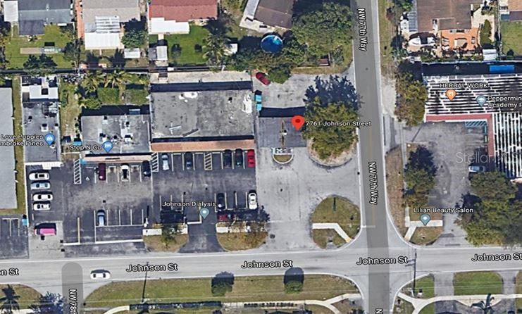 This is an aerial satellite map view of a commercial property and surrounding street intersection — 7761 JOHNSON STREET, PEMBROKE PINES, FL
