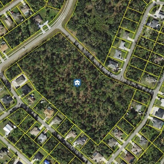 This is an aerial map view showing a vacant, wooded residential lot outlined in yellow — 3100 S CRANBERRY BOULEVARD, NORTH PORT, FL