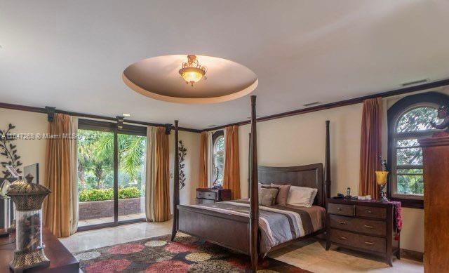A bedroom features a four-poster bed, a recessed ceiling light, and sliding glass doors to outdoors — San Rafael Escazu San Jose Prov. Escazu, CR, CR
