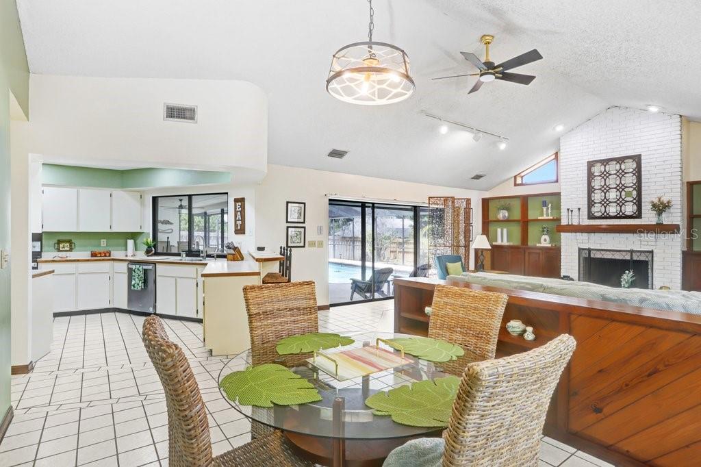 A kitchen with white cabinets, stainless steel appliances, and a tiled floor — 507 SPORTSMAN PARK DRIVE, SEFFNER, FL