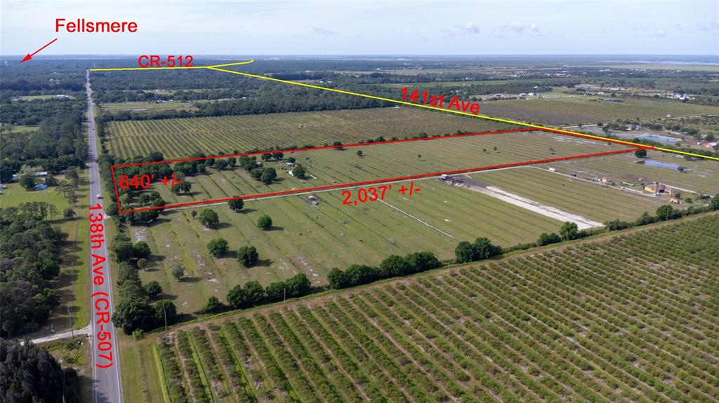 An aerial view shows a rectangular plot of land outlined in red near a road — 11525 138TH AVENUE, FELLSMERE, FL