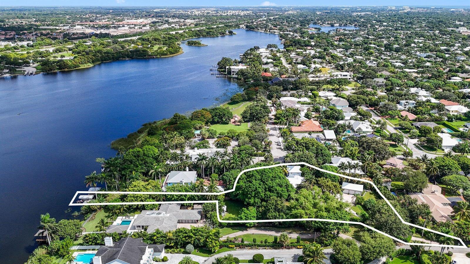 An aerial view shows a waterfront residential property outlined in white on a lush lot — 920 Hibiscus Lane, Delray Beach FL 33444, DELRAY BEACH, FL