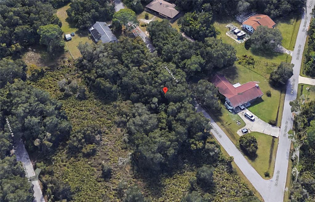 This is an aerial map view of a wooded residential lot with surrounding houses — SANTA ROSA STREET, NORTH PORT, FL