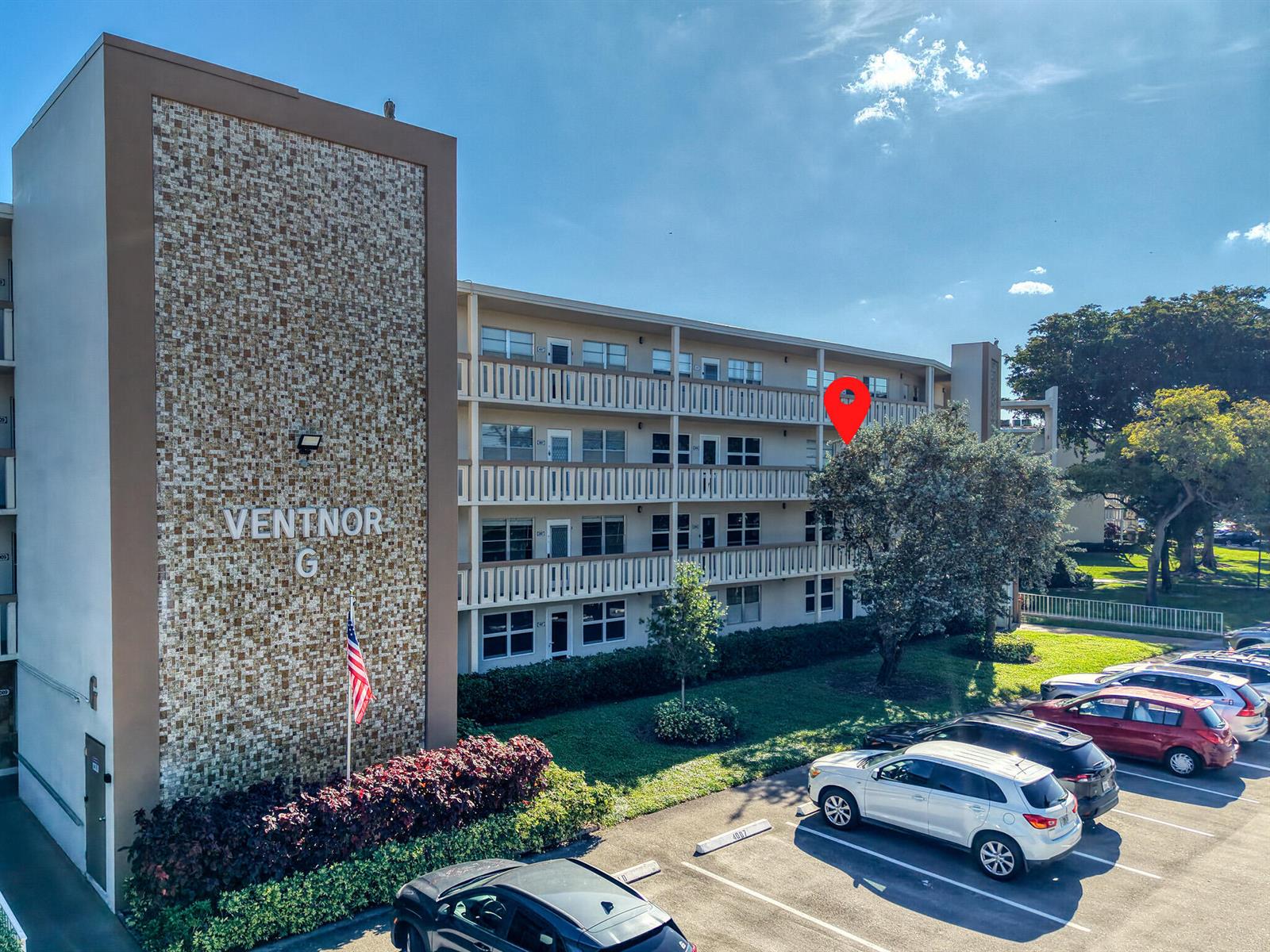 An exterior view of a multi-story apartment building with a red location pin — 3002 Ventnor # G, Deerfield Beach FL 33442, DEERFIELD BEACH, FL