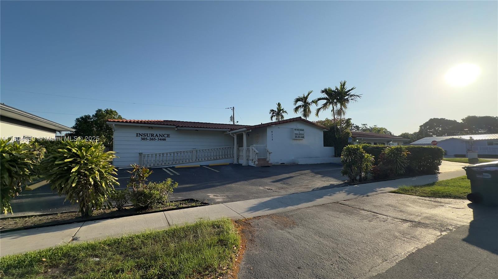 A single-story commercial building with a white exterior, a ramp, and a parking lot — 8315 SW 24th St # B, Miami FL 33155, MIAMI, FL