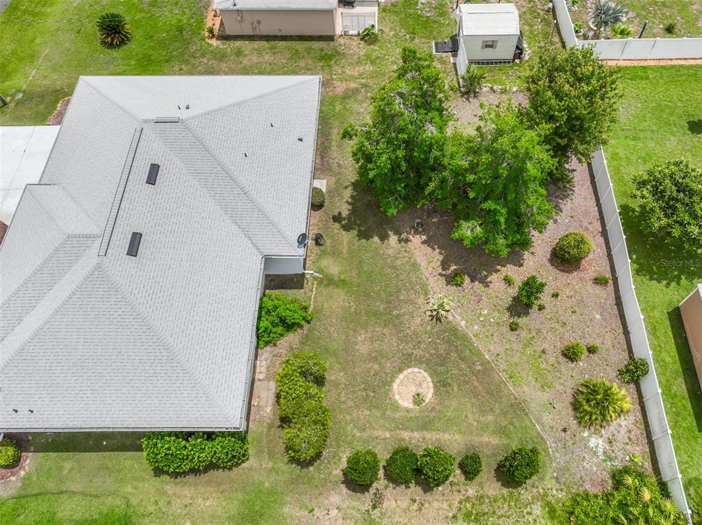 An aerial view shows a house with a gray roof and a large backyard — 8 EASTGATE LANE, PALM COAST, FL