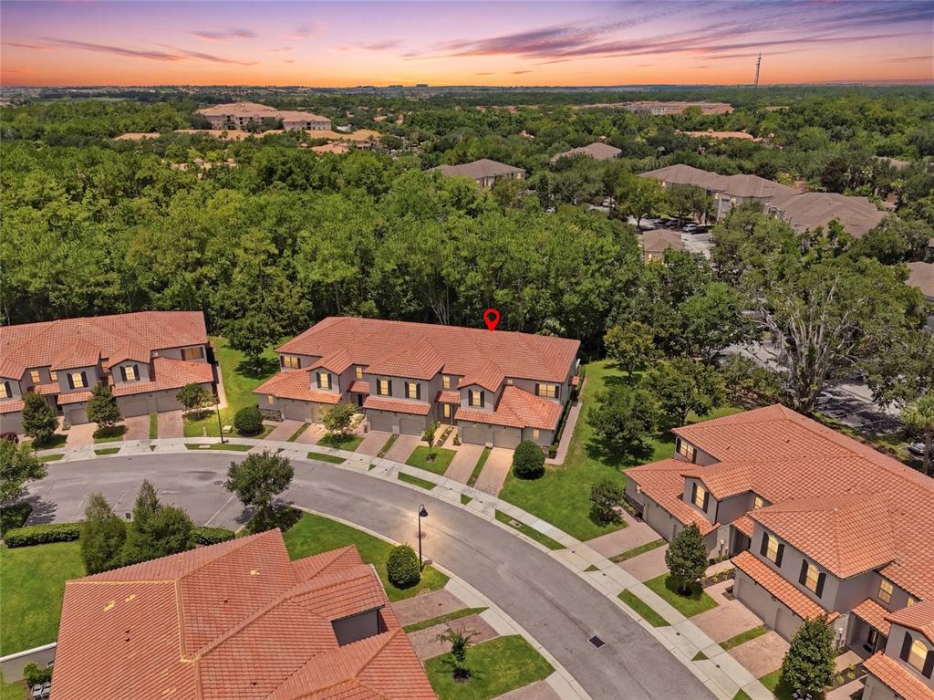 An aerial view shows a residential neighborhood with townhomes featuring red tile roofs — 8129 ROSEVILLE ROAD, DAVENPORT, FL