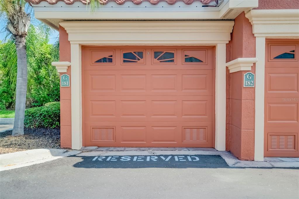 A view of a garage door labeled G 181 with a reserved parking space — 2741 VIA CIPRIANI UNIT 930A, CLEARWATER, FL