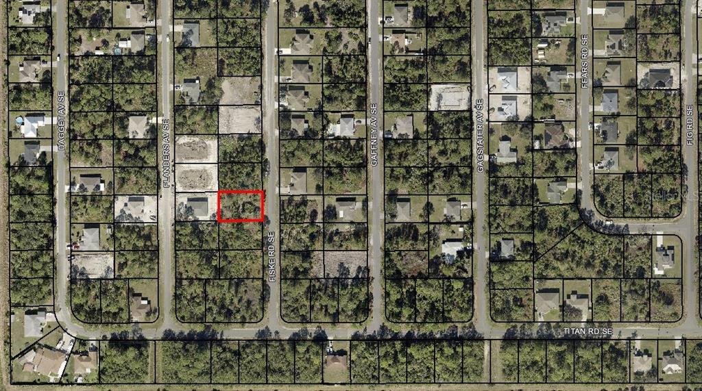 This is an aerial map showing a vacant lot highlighted in red within a residential neighborhood — 3014 FISKE ROAD SE, PALM BAY, FL