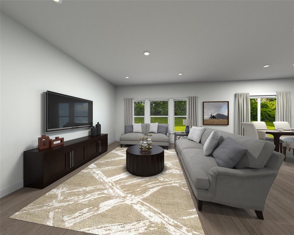 This is a digital rendering of a living room featuring gray furniture and a patterned rug — 5318 WILLOW CREEK, HAINES CITY, FL
