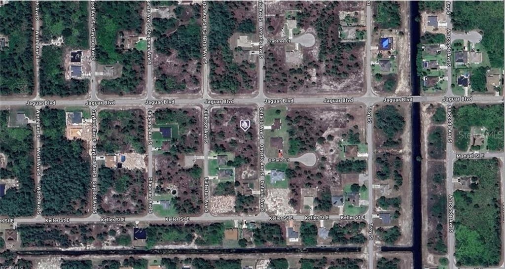 This is an aerial map view of a residential neighborhood with vacant lots and houses — 804 ONTARIO AVENUE S, LEHIGH ACRES, FL