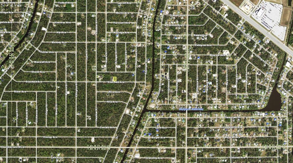This is an aerial map showing a residential neighborhood grid with streets and a waterway — 14316 STANFIELD AVENUE, PORT CHARLOTTE, FL