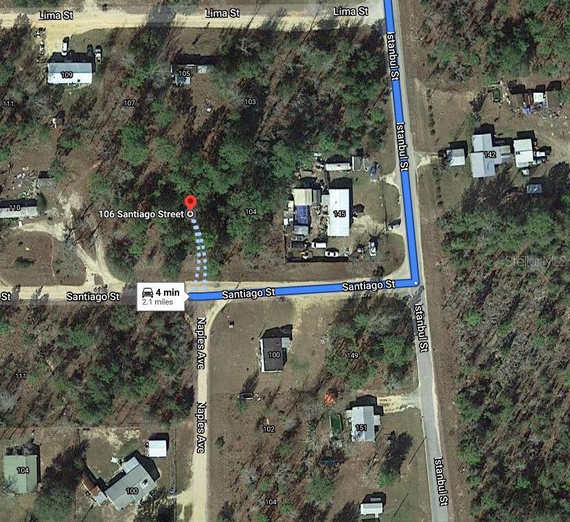 This is a satellite map view showing residential properties, wooded lots, and local street layouts — 106 SANTIAGO STREET, INTERLACHEN, FL