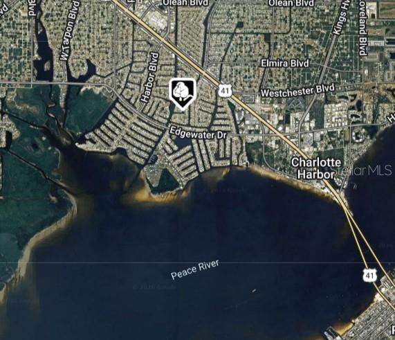This is an aerial map showing a residential neighborhood located along the Peace River — 189 POINSETTIA CIRCLE NE, PORT CHARLOTTE, FL