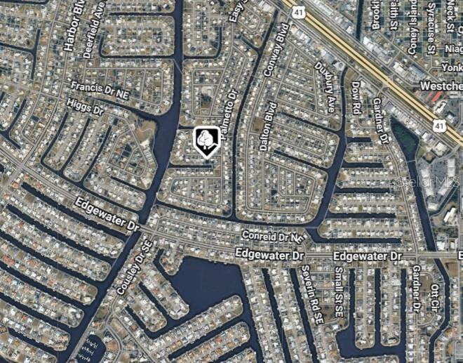 This is an aerial map view of a residential neighborhood with canals and streets — 189 POINSETTIA CIRCLE NE, PORT CHARLOTTE, FL